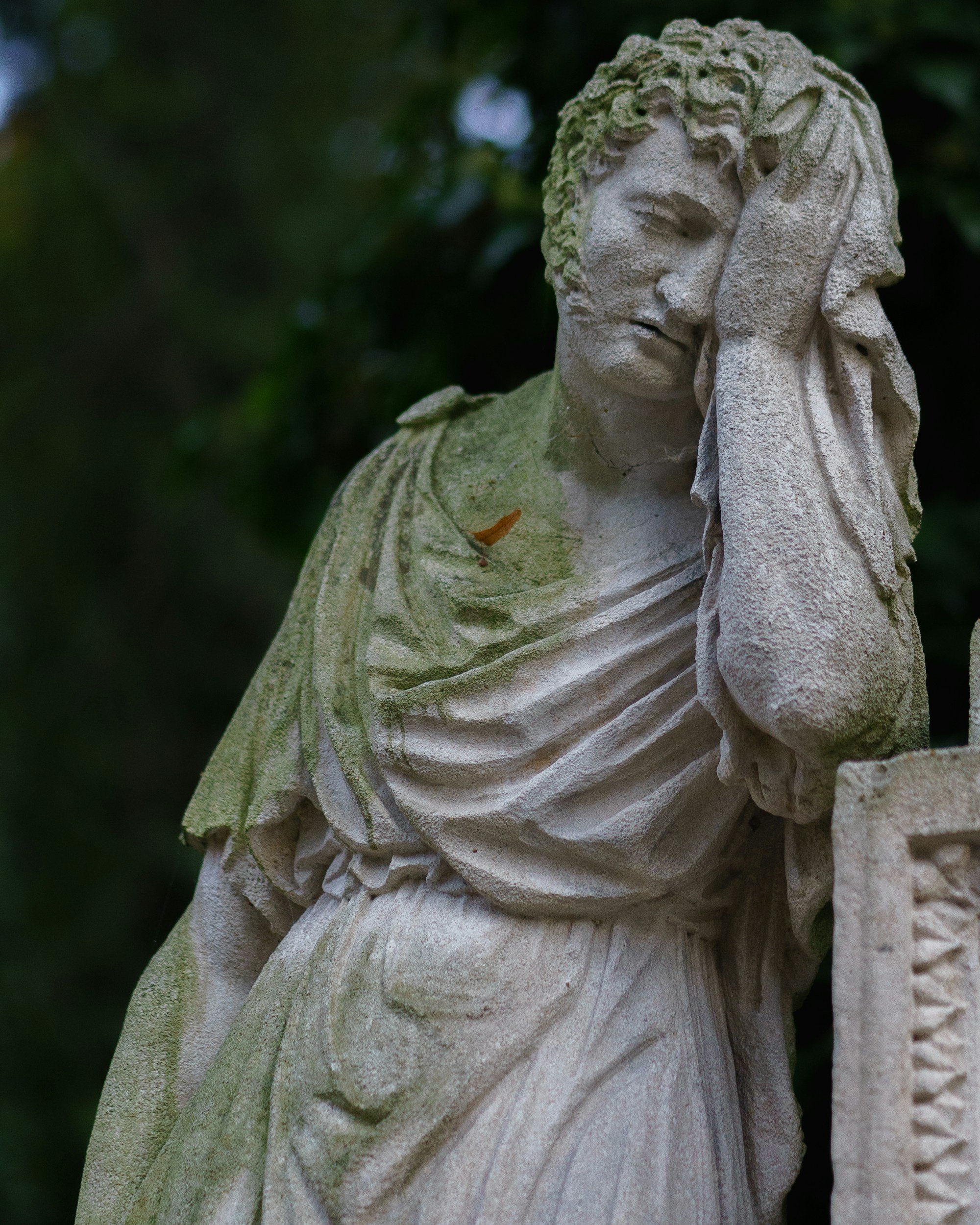 stone statue of a man thinking